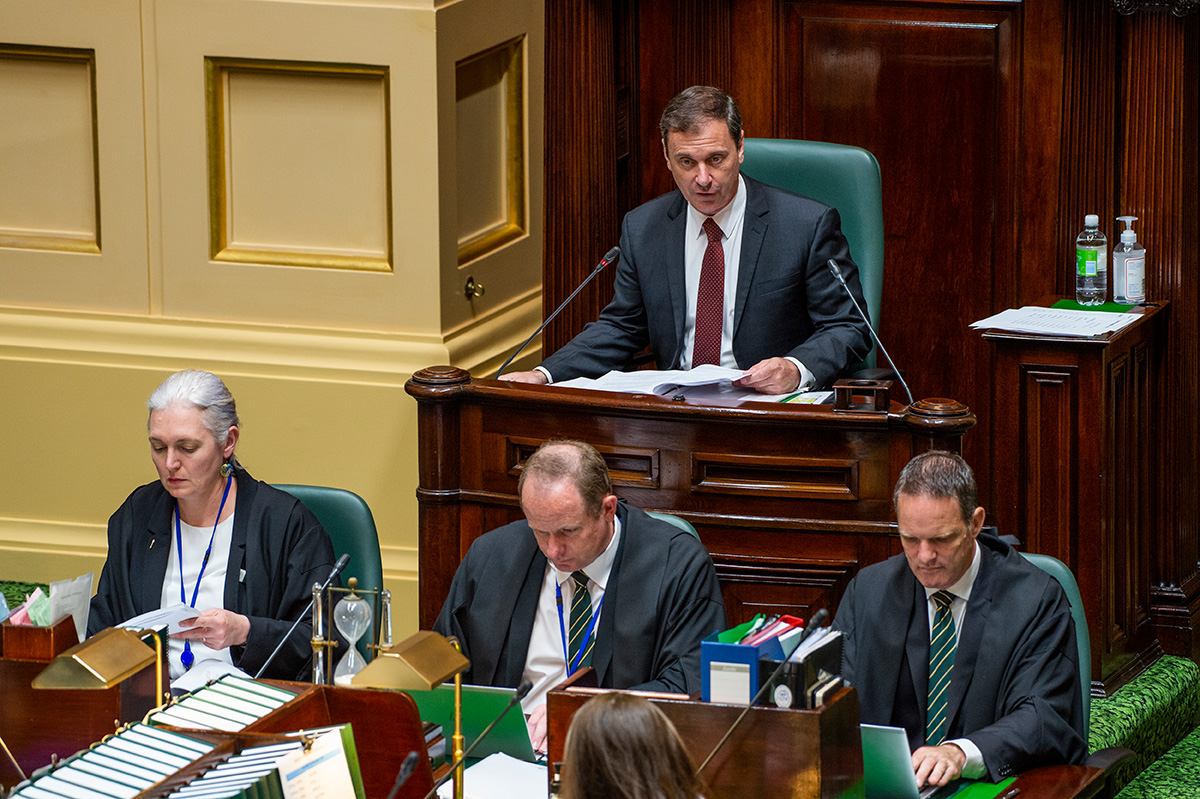 Clerks at work in the Legislative Assembly chamber, seated in front of the Speaker.